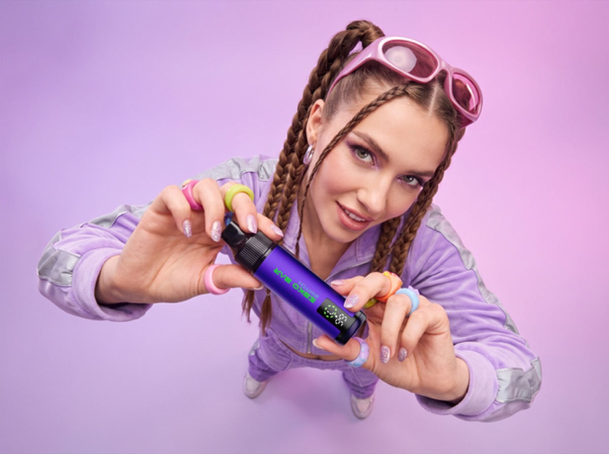 Person in purple with ESKO BAR
