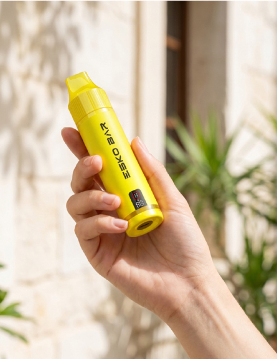 Hand holding yellow ESKO BAR outdoors